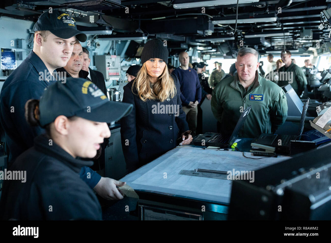 First Lady Melania Trump, joined by U.S. Navy Capt. Chris Hill, interacts  with sailors on the bridge of USS George H.W. Bush Wednesday, Dec. 12,  2018, during a holiday visit to the