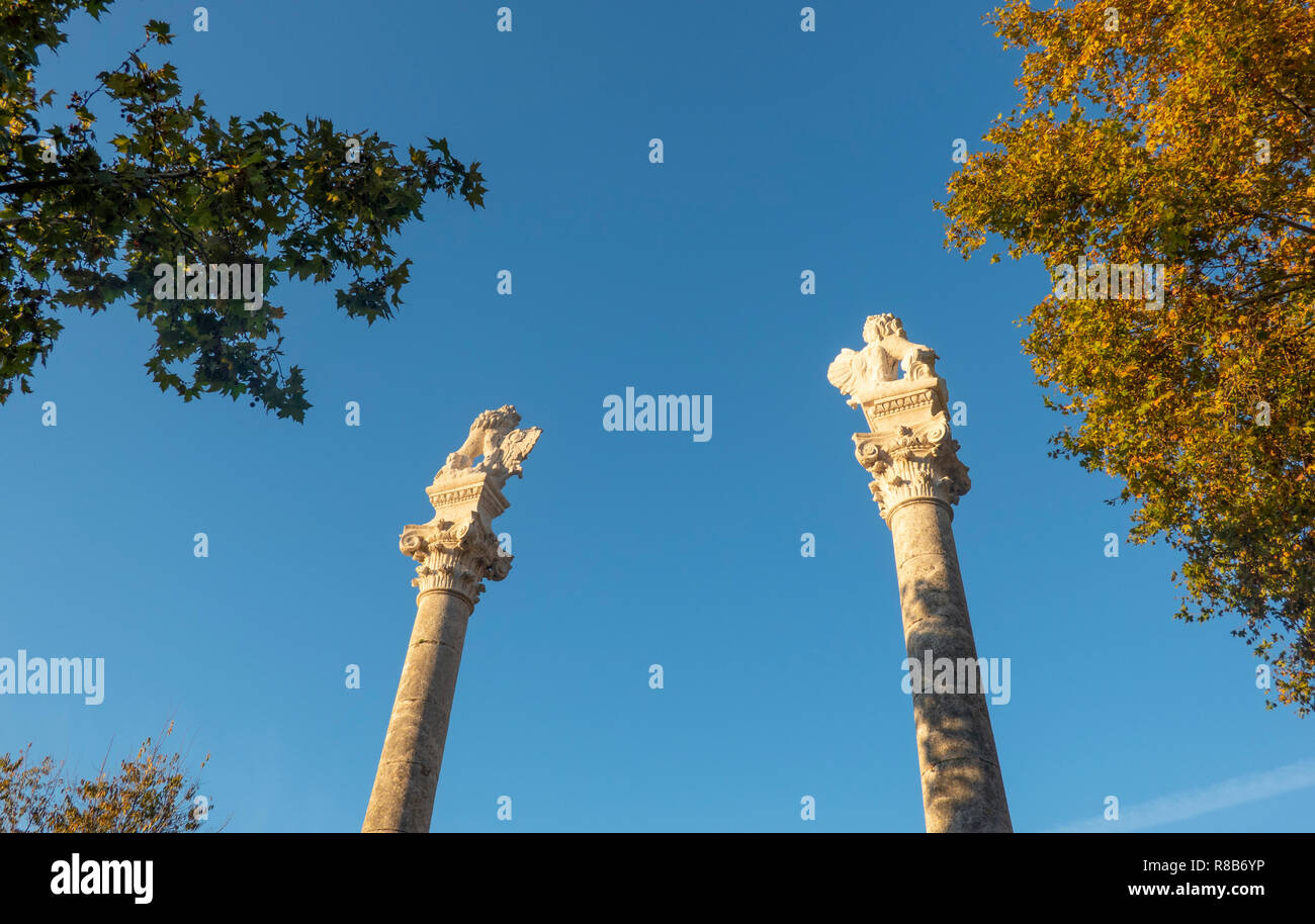 Statues of Hercules and Julius Caesar on pedestals in the Alameda de