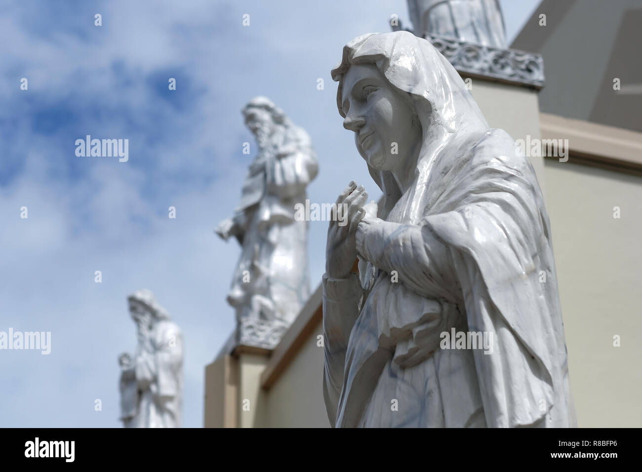 Sculpted religious figures decorating facade of the Roman Catholic Antipolo Cathedral or National Shrine of Our Lady of Peace and Good Voyage located in the city of Antipolo, in the province of Rizal in the Philippines. Stock Photo