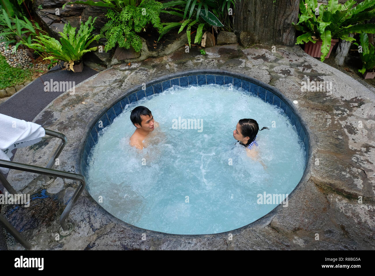 A Young Filipino Couple Bathing In A Swimming Pool In Luljetta S Place Garden Suites Specialty Hotel In Antipolo City In The Philippines Stock Photo Alamy