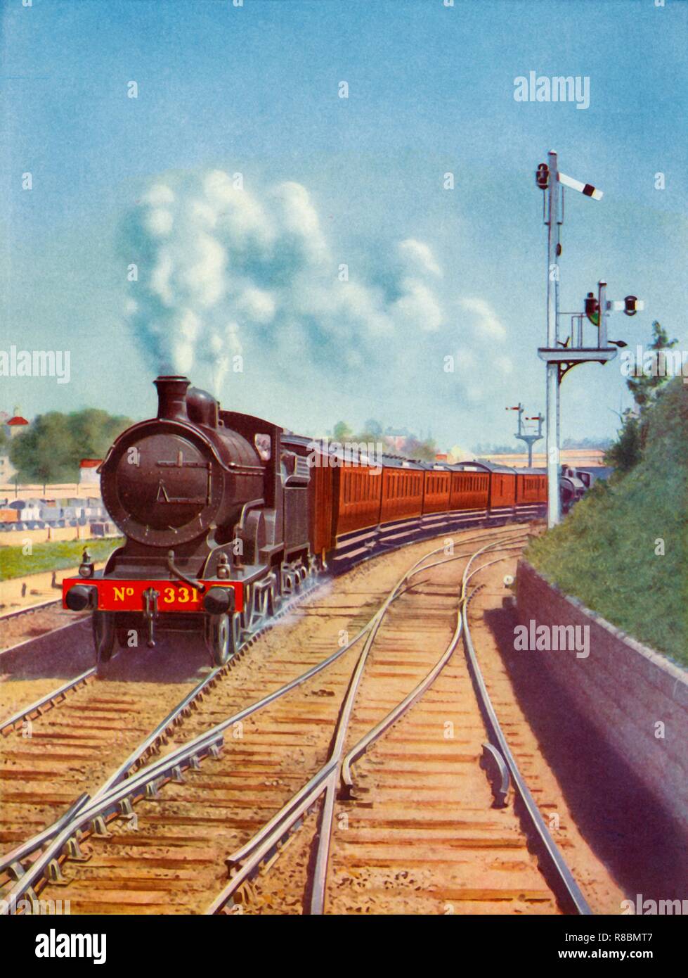 'Leaving Dublin. Great Southern Railways train, hauled by a 4-4-0 passenger express', 1935. Creator: Unknown. Stock Photo