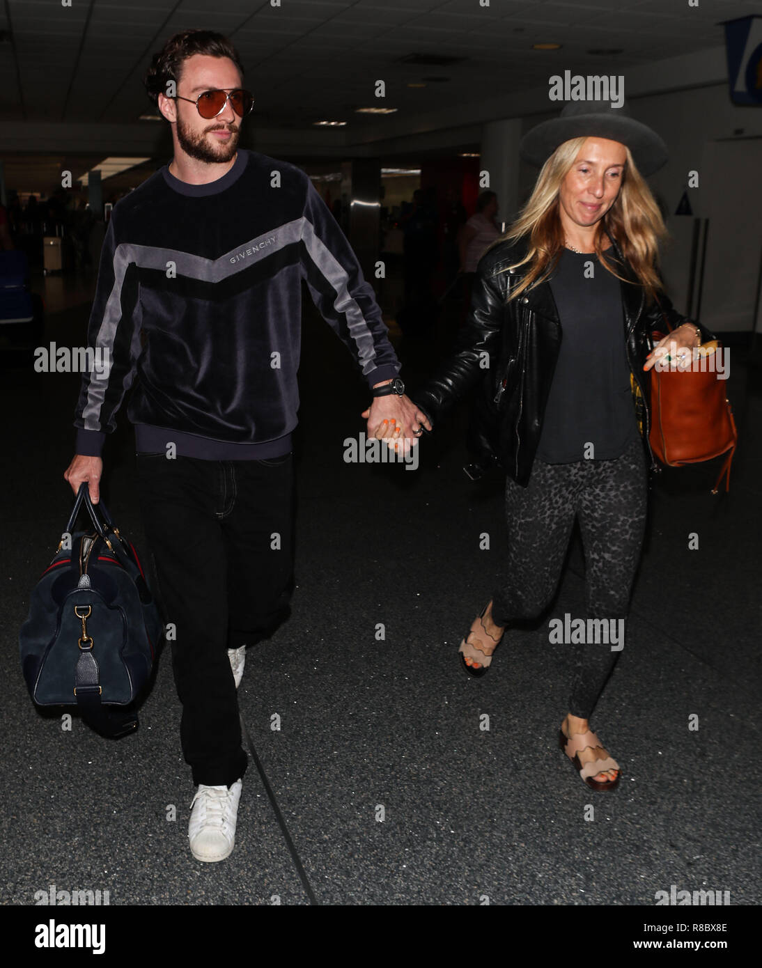 LOS ANGELES, CA, USA - SEPTEMBER 05: Aaron Taylor-Johnson and Sam Taylor-Johnson seen at Los Angeles International Airport (LAX) on September 5, 2018 in Los Angeles, California, United States. (Photo by Image Press Agency) Stock Photo