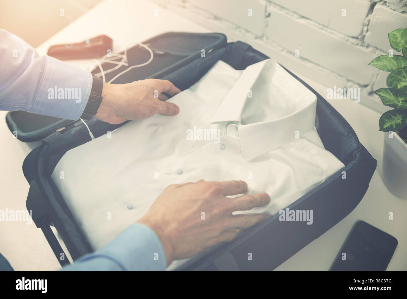 man packing travel suitcase for business trip Stock Photo Alamy