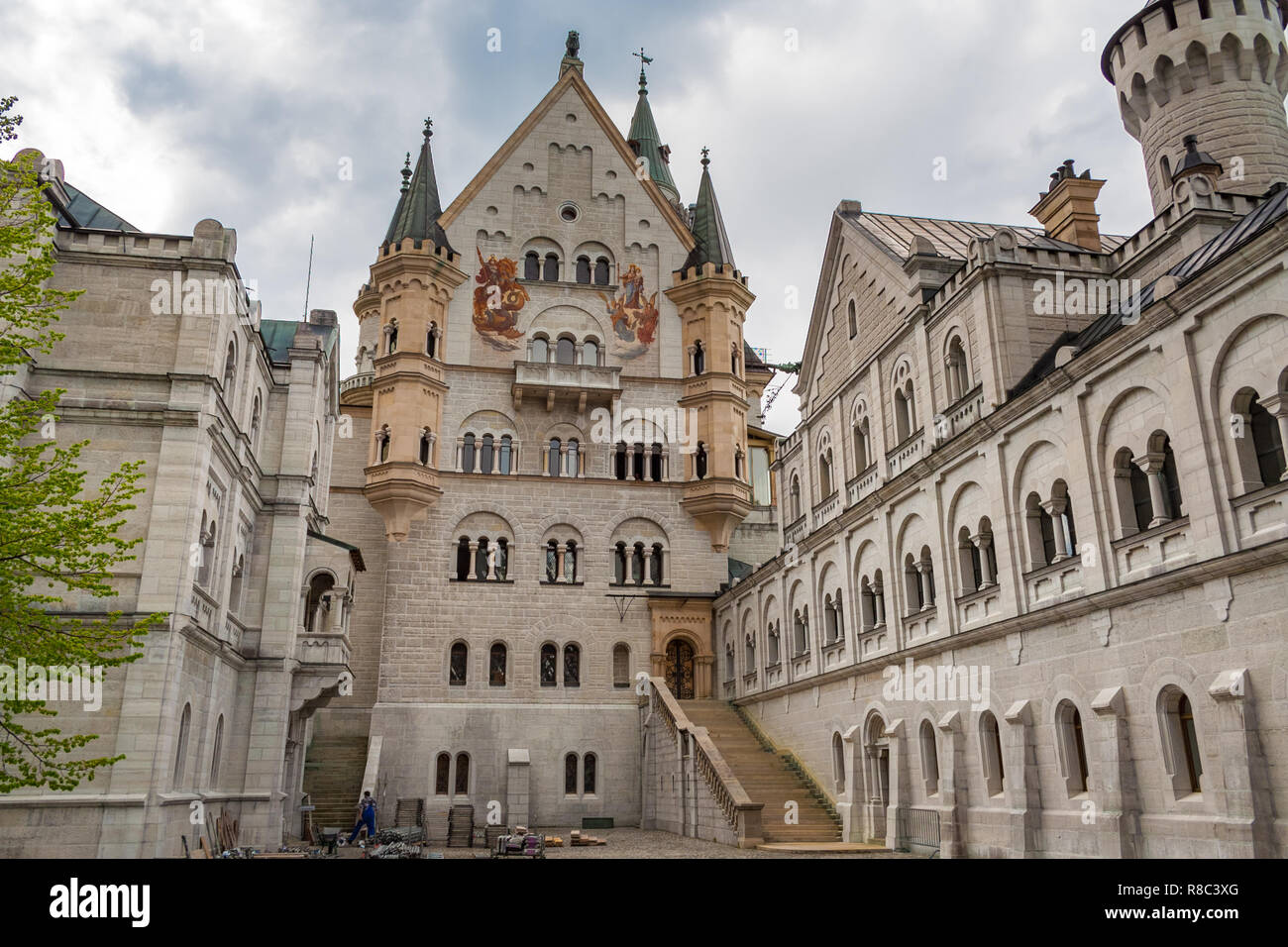 Nice view of the upper courtyard level of the famous Neuschwanstein Castle. On the left is the Bower, in the centre is the palace with two big... Stock Photo