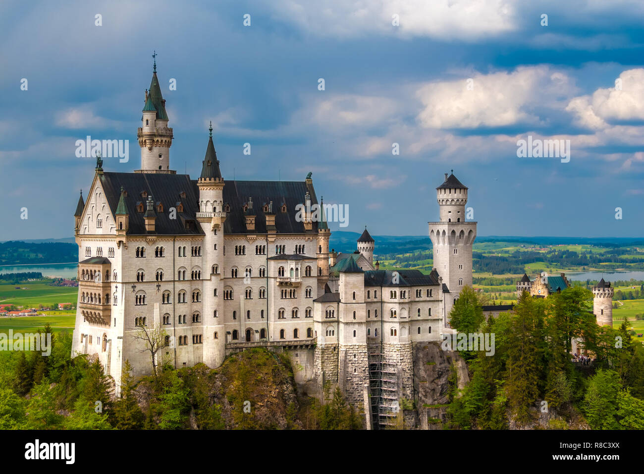 Nice close view of the southern side of the famous Neuschwanstein Castle, a Romanesque Revival palace on a rugged hill above the village of... Stock Photo