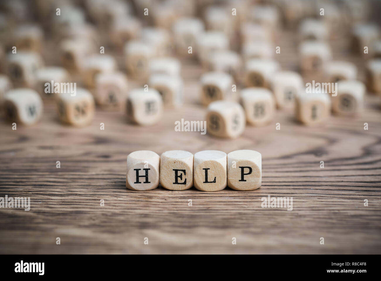 dice forming the word HELP Stock Photo