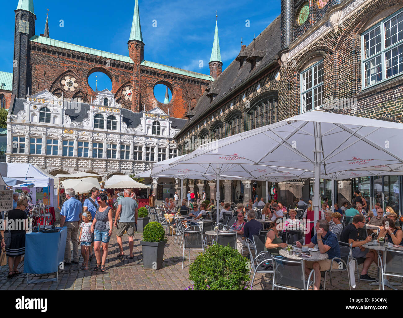 Cafe in front of the historic 13th century Rathaus (Town Hall), Markt, Lubeck, Schleswig-Holstein, Germany Stock Photo