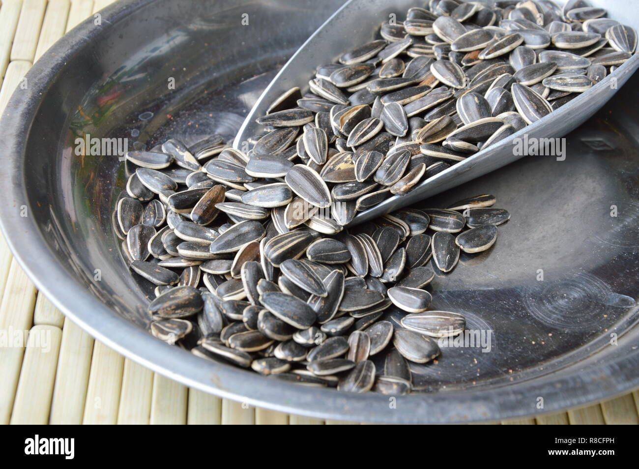 sunflower seed in iron scoop on stainless tray Stock Photo Alamy