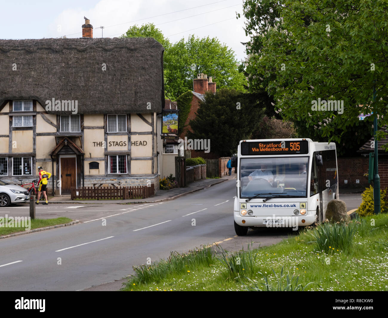 A rural bus stops outside the Stag's Head pub in the heart of the