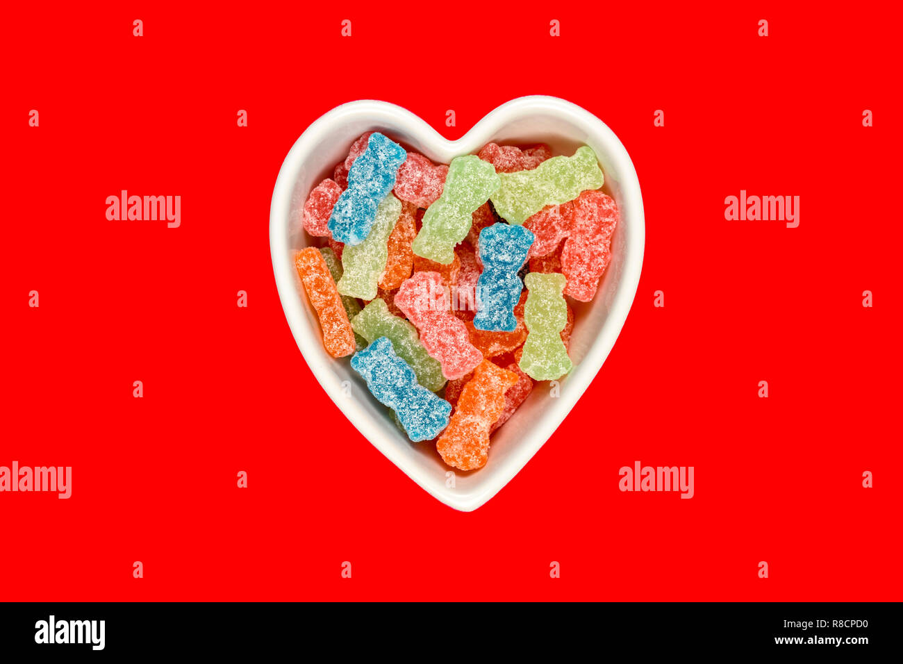 Variety of different color sweet and sour candy or sugar junk food in a