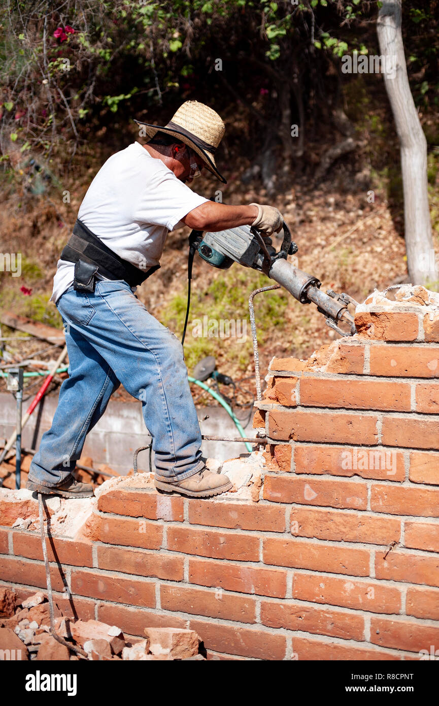 Man demolishing wall hires stock photography and images Alamy