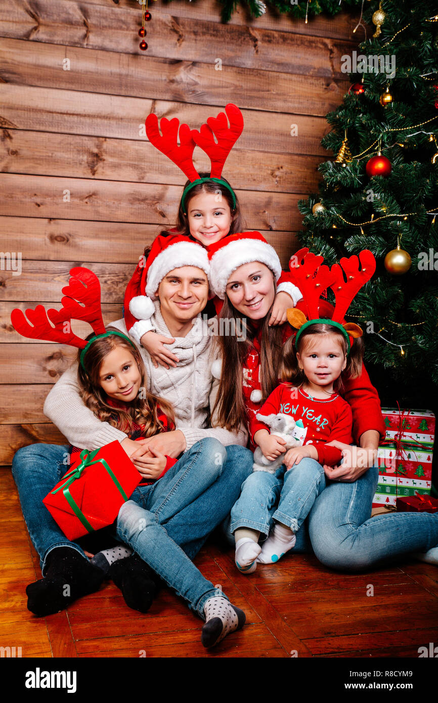 gift boxes sittting near Christmas tree 