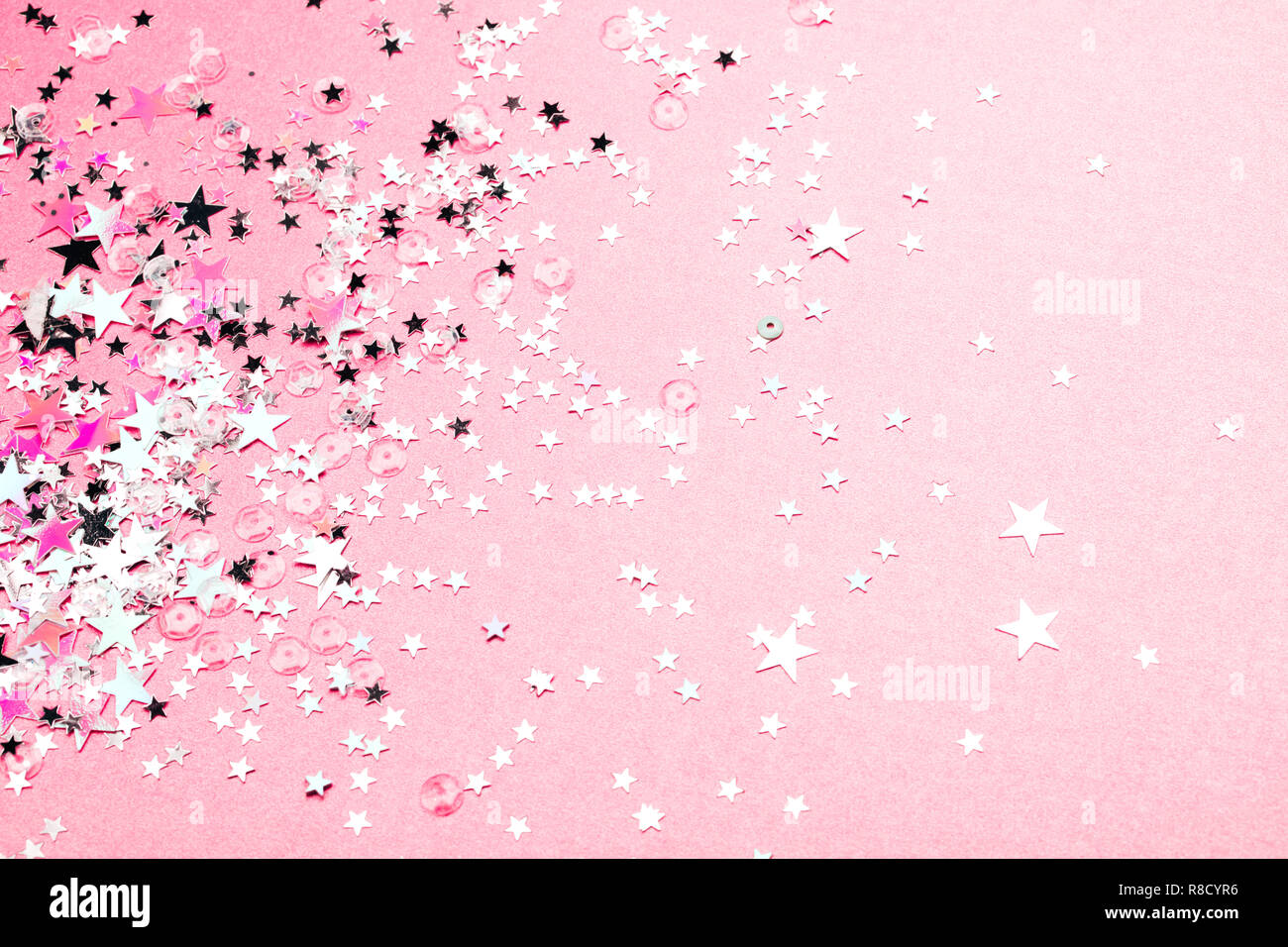 Silver star glitter on pink pastel background. Festive concept. Place for  design Stock Photo - Alamy