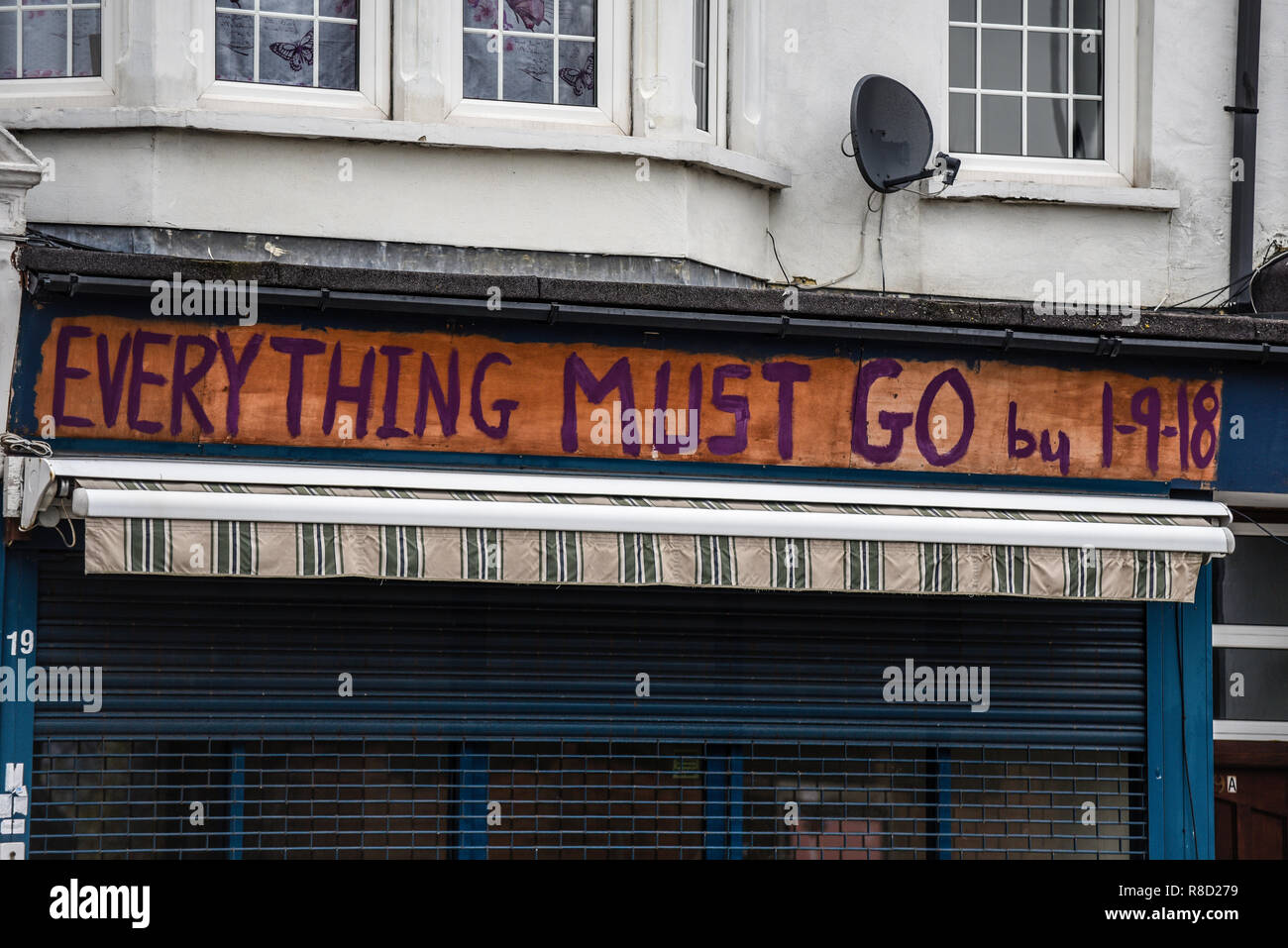 Everything must go by 1-9-18  rough painted sign. Closed. Shut down. Urban decay Stock Photo