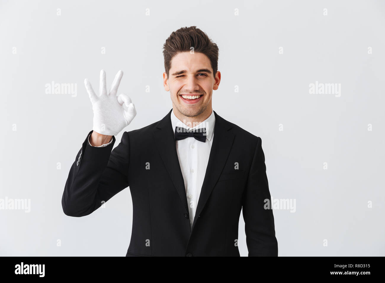 Butler wearing tuxedo white glove hi-res stock photography and images