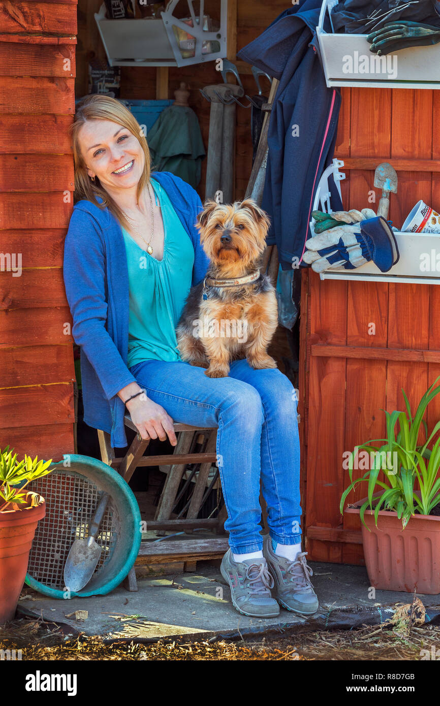 Image of TRACY McDOWELL and her Yorkshire terrier, Jack, Plot 78A, Eglinton Gardens, Kilwinning, Ayrshire Stock Photo