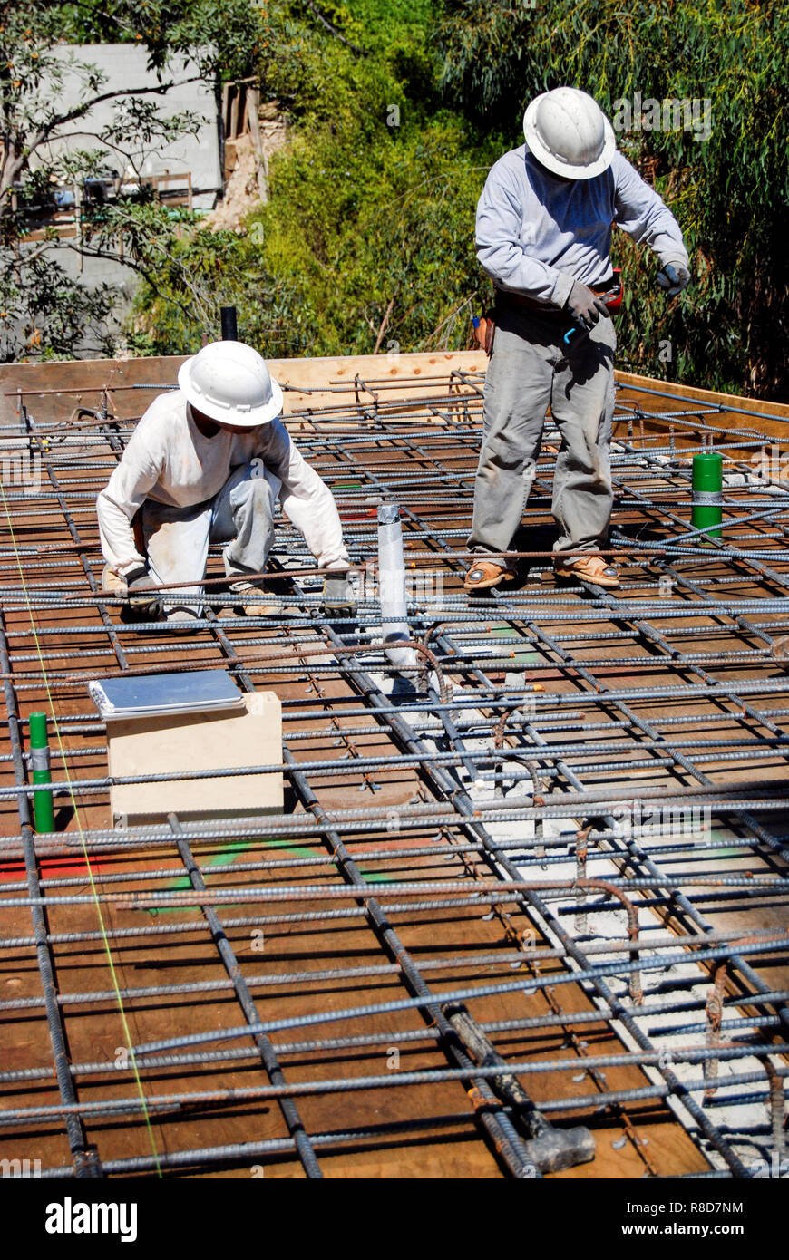 construction workers tying rebar Stock Photo Alamy