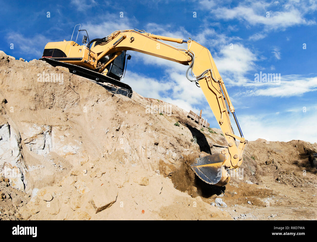 excavator digging hillside foundation Stock Photo Alamy