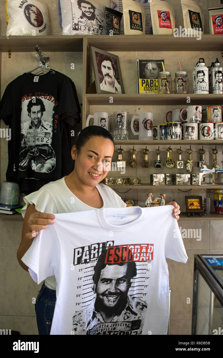 Yamile Zapata, owner of the El Patrón store where she sells t-shirts and  souvenirs with the image of Pablo Escobar Stock Photo - Alamy