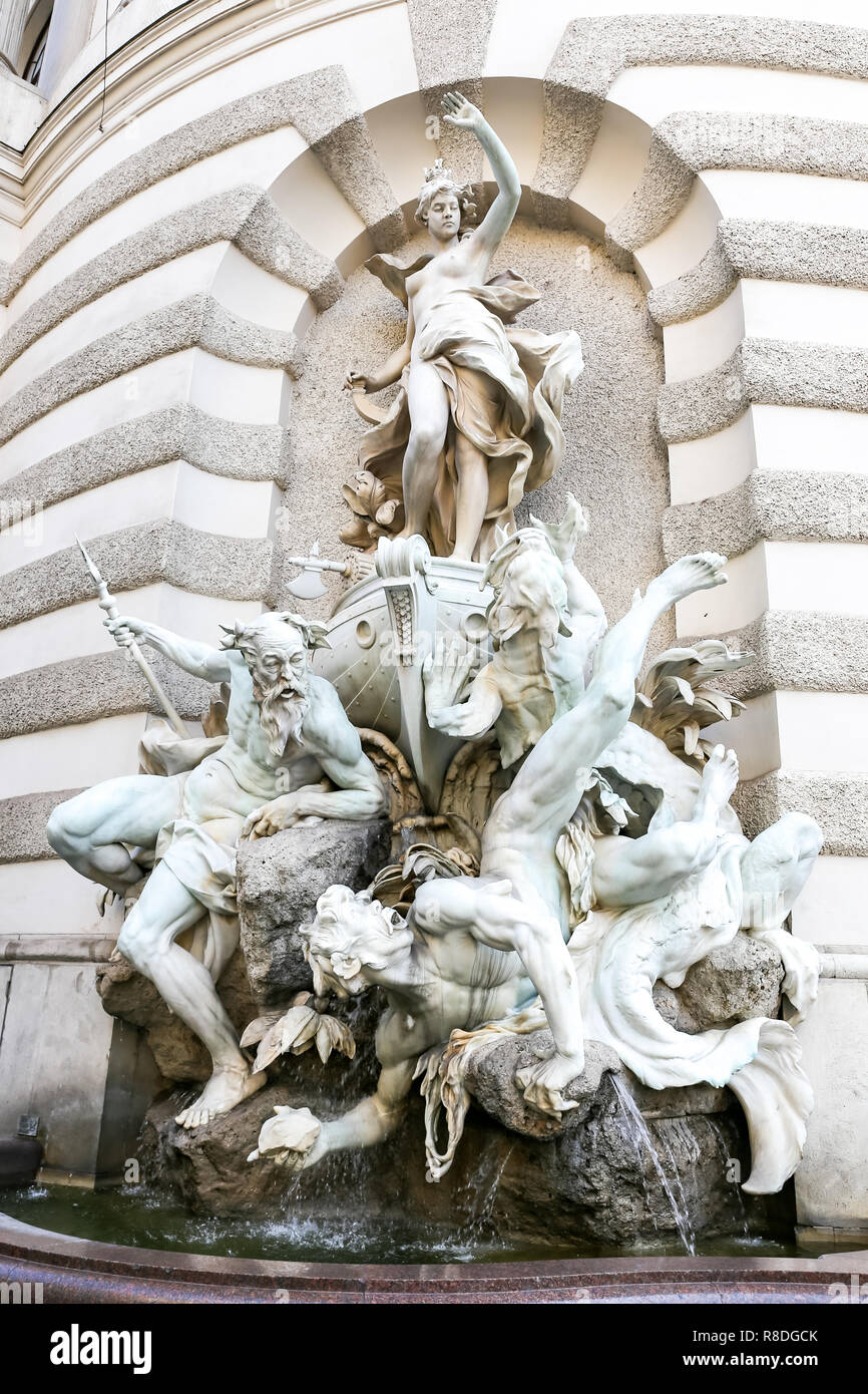Statues in Michaelerplatz Fountain, Vienna City, Austria Stock Photo