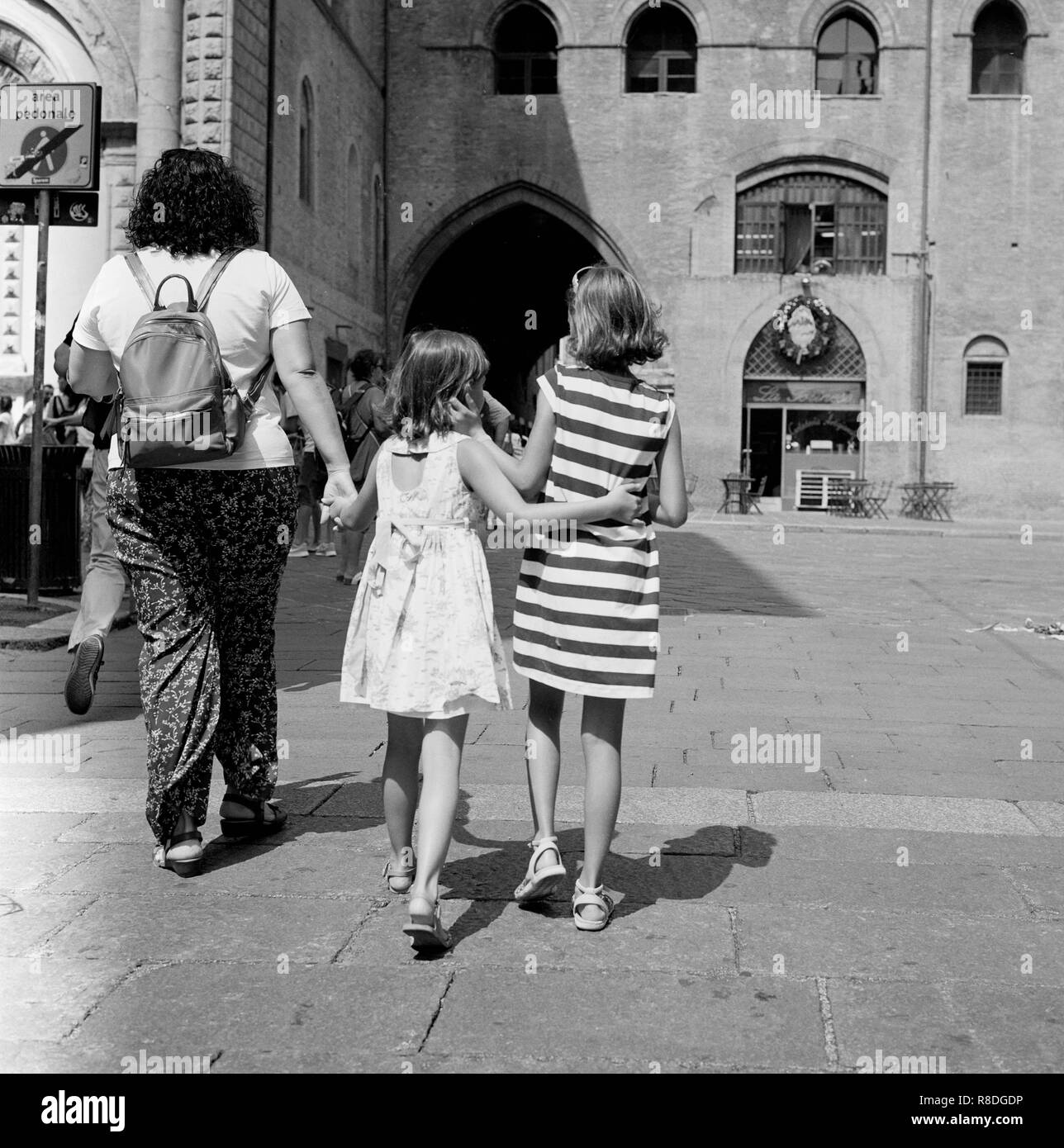 children sisters walking in Bologna. Spring 2018. Rolleiflex made Stock Photo