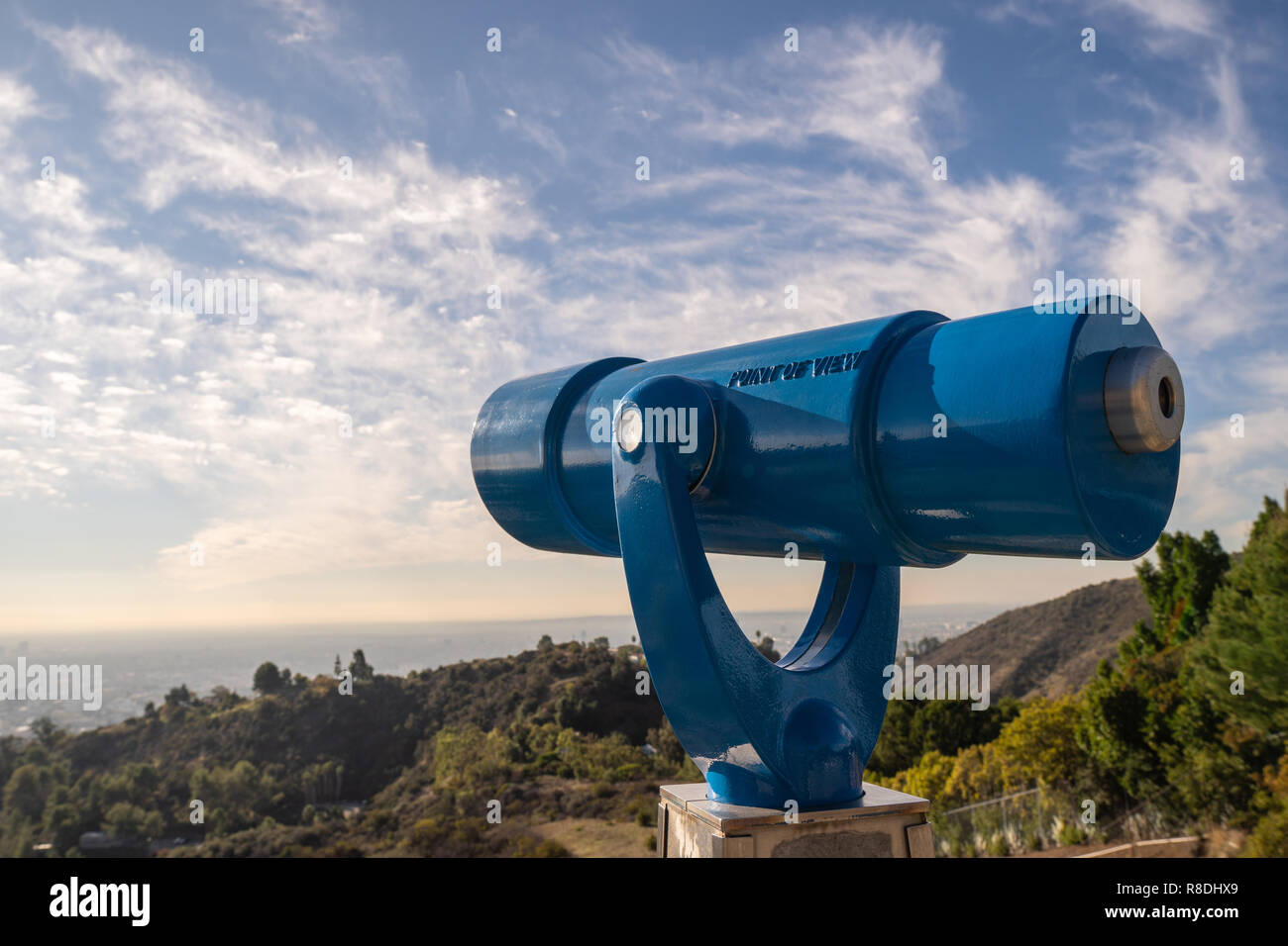 Spyglass on observation deck on Hollywood Hills. Warm sunny day. Beautiful clouds in blue sky Stock Photo