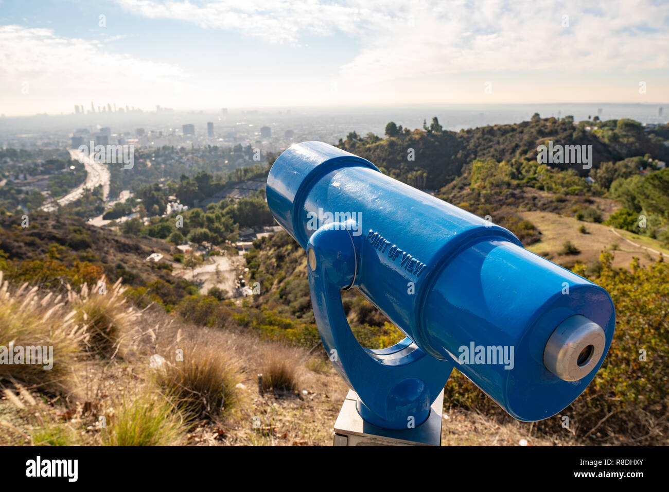 Spyglass on observation deck on Hollywood Hills. Warm sunny day. Beautiful clouds in blue sky Stock Photo