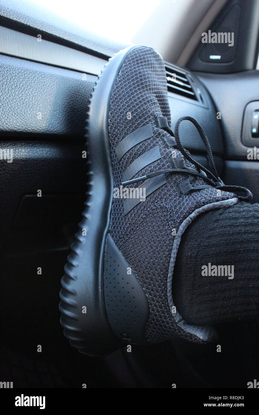 Adidas Cloudfoam Ultimate Athletic Shoes Inside Black Leather Car Stock  Photo - Alamy