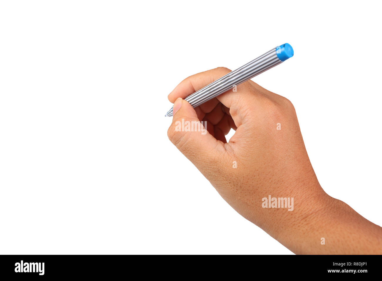 Photo image of a hand holding pen in writing position isolated on white with empty space Stock Photo