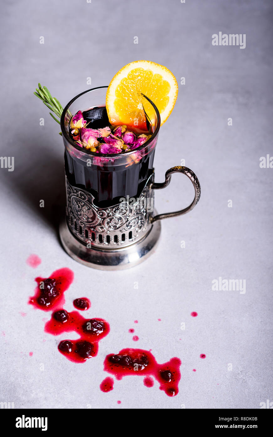 Christmas mulled wine or gluhwein with spices and orange slices. Hot winter drink. Copy space. Stock Photo