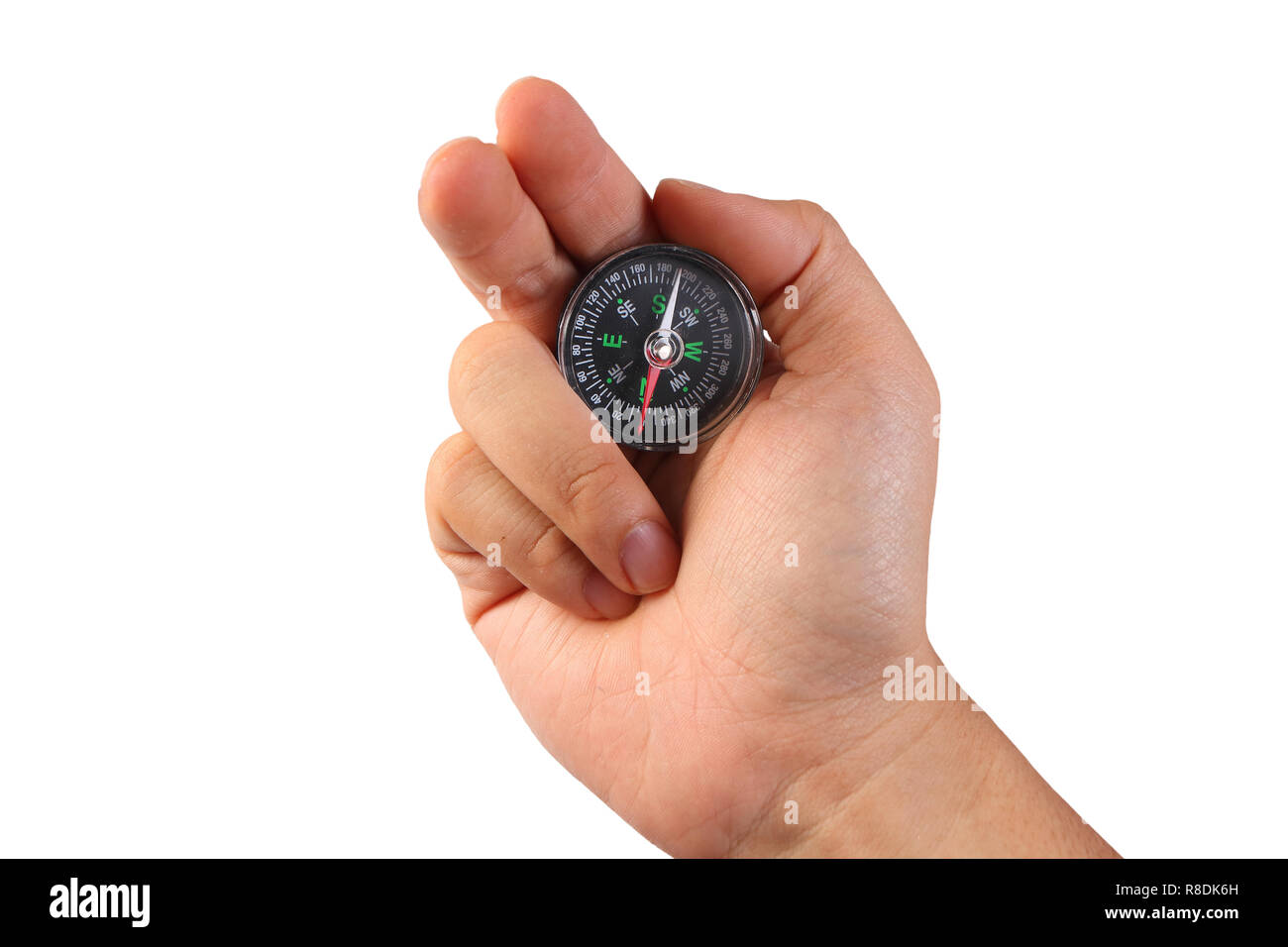 Photo image of a hand holding compass isolated on white with empty space Stock Photo