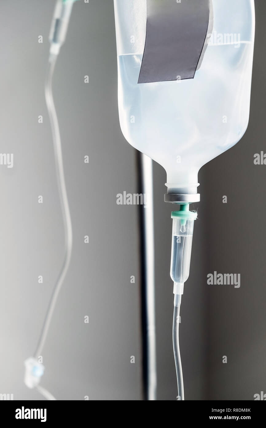 Close up of IV saline solution drip for patient in hospital Stock Photo ...