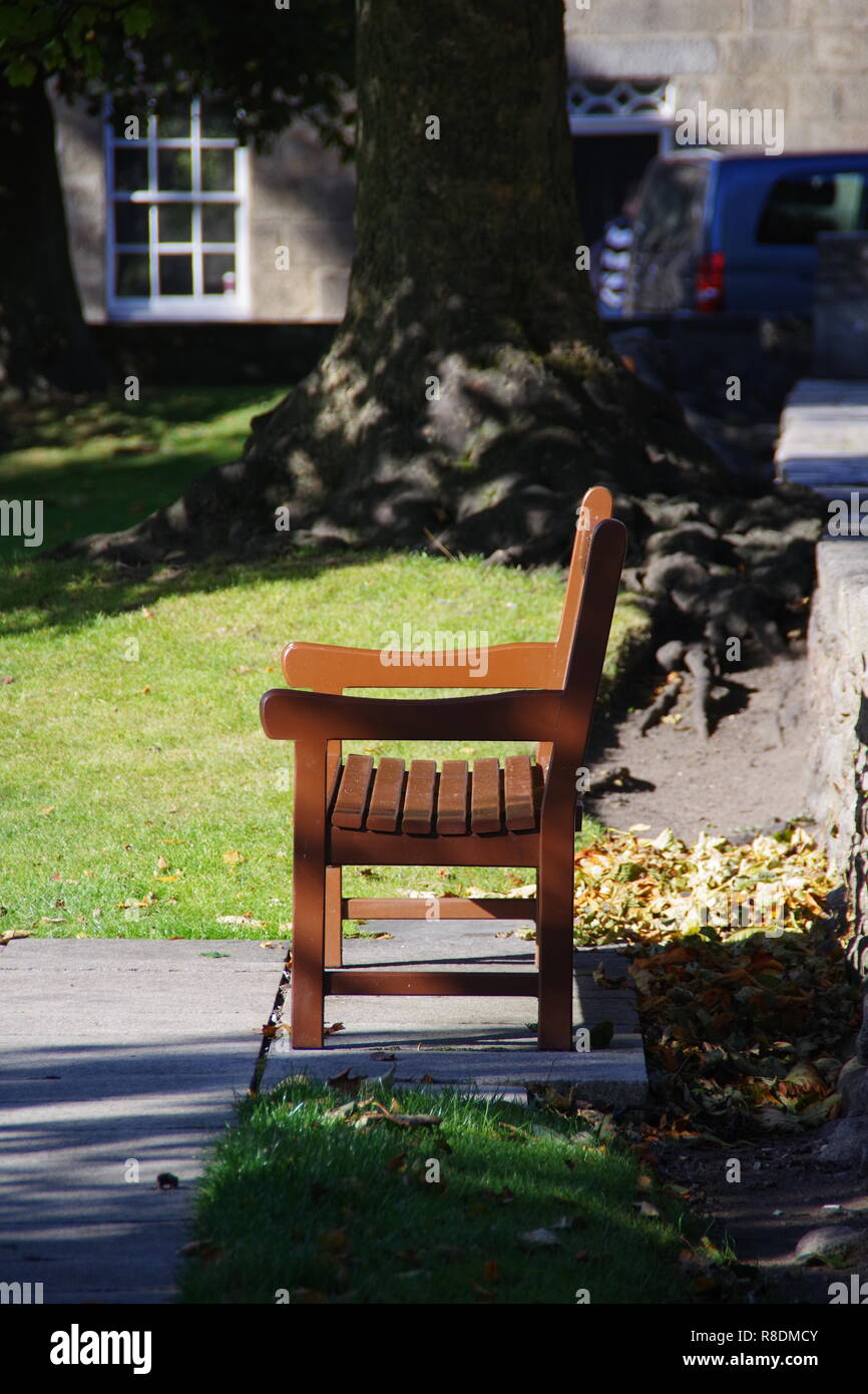 Wooden Bench on Aberdeen University Lawn on an Autumn Day. Old Aberdeen, Scotland, UK. Stock Photo