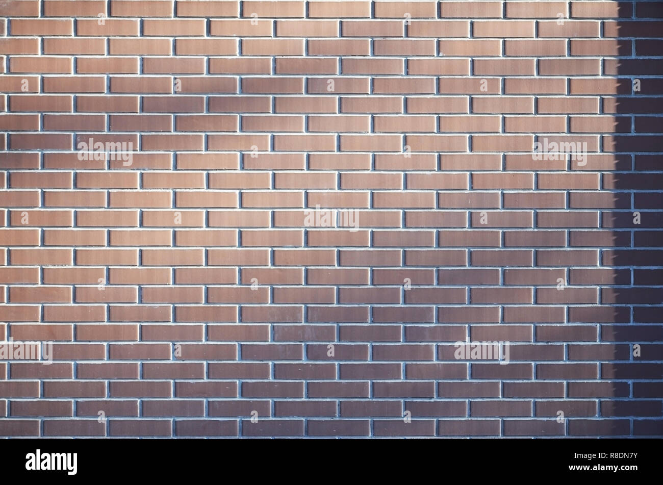 Weathered stained old brown brick wall background. Texture of an old ...