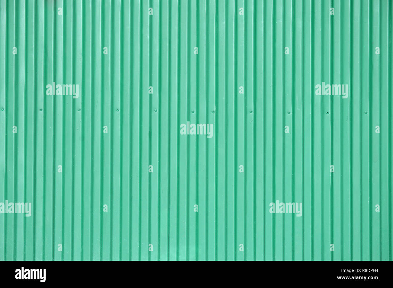 Siding, metal panels texture closeup in the daytime outdoors. Metal