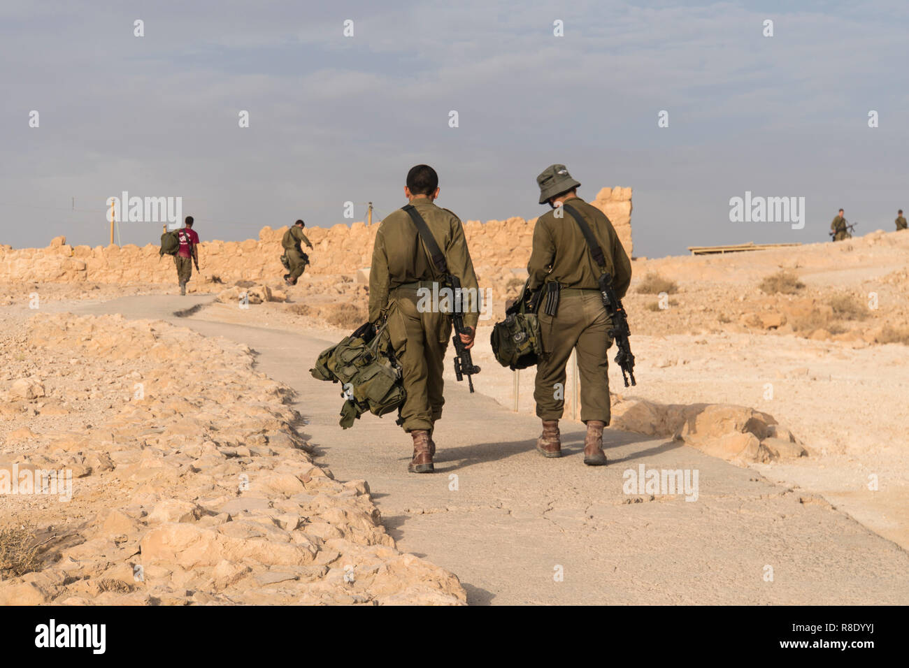 Soldiers are patrolling for security Israeli army military exercises in the early morning in the ruins of the fortress Massada. Palestinian Israeli co Stock Photo