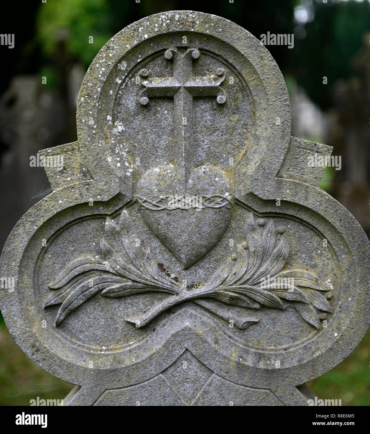 Headstone,tombstone,sacred heart,Catholic, graveyard,graveyards,grave,graves,memory,memorial,peace,peaceful,RM Ireland Stock Photo