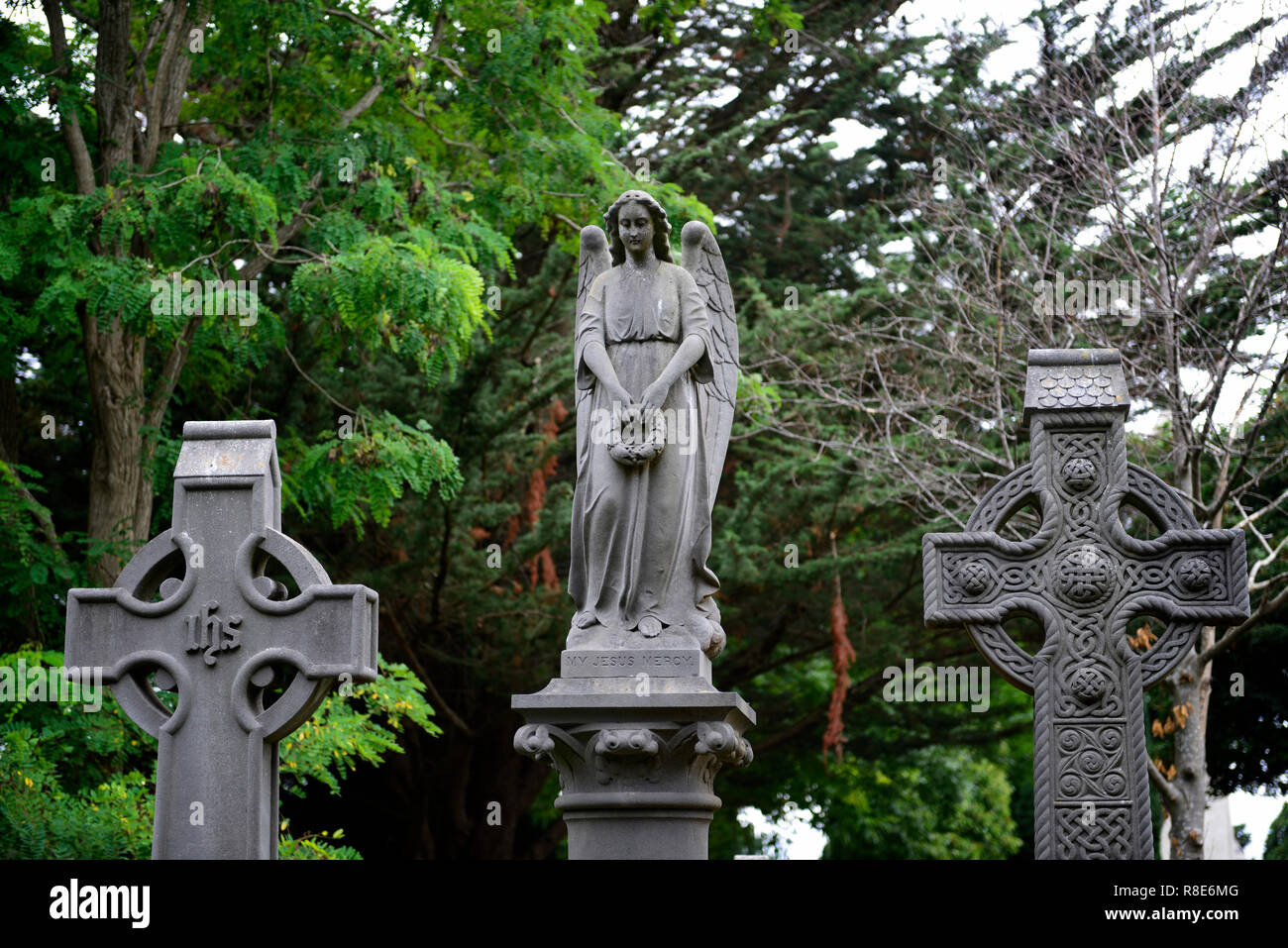 Headstone,tombstone,Angel,Catholic, graveyard,graveyards,grave,graves,memory,memorial,peace,peaceful,RM Ireland Stock Photo