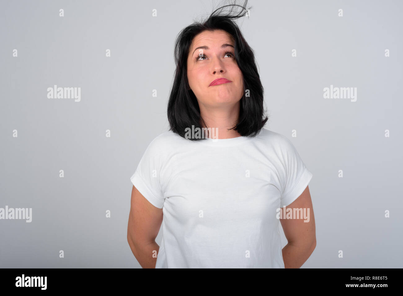 Beautiful Woman Blowing Hair Against White Background Stock Photo Alamy