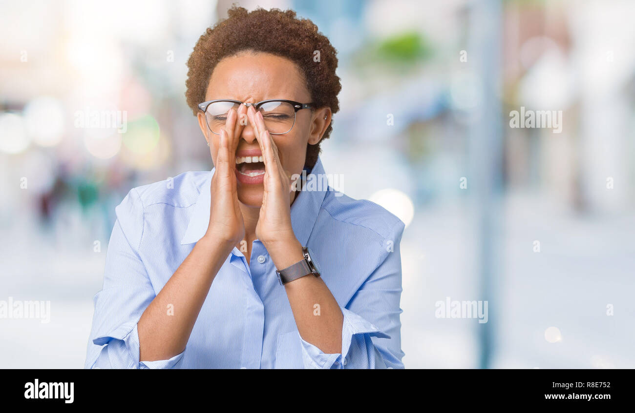 Young beautiful african american business woman over isolated ...