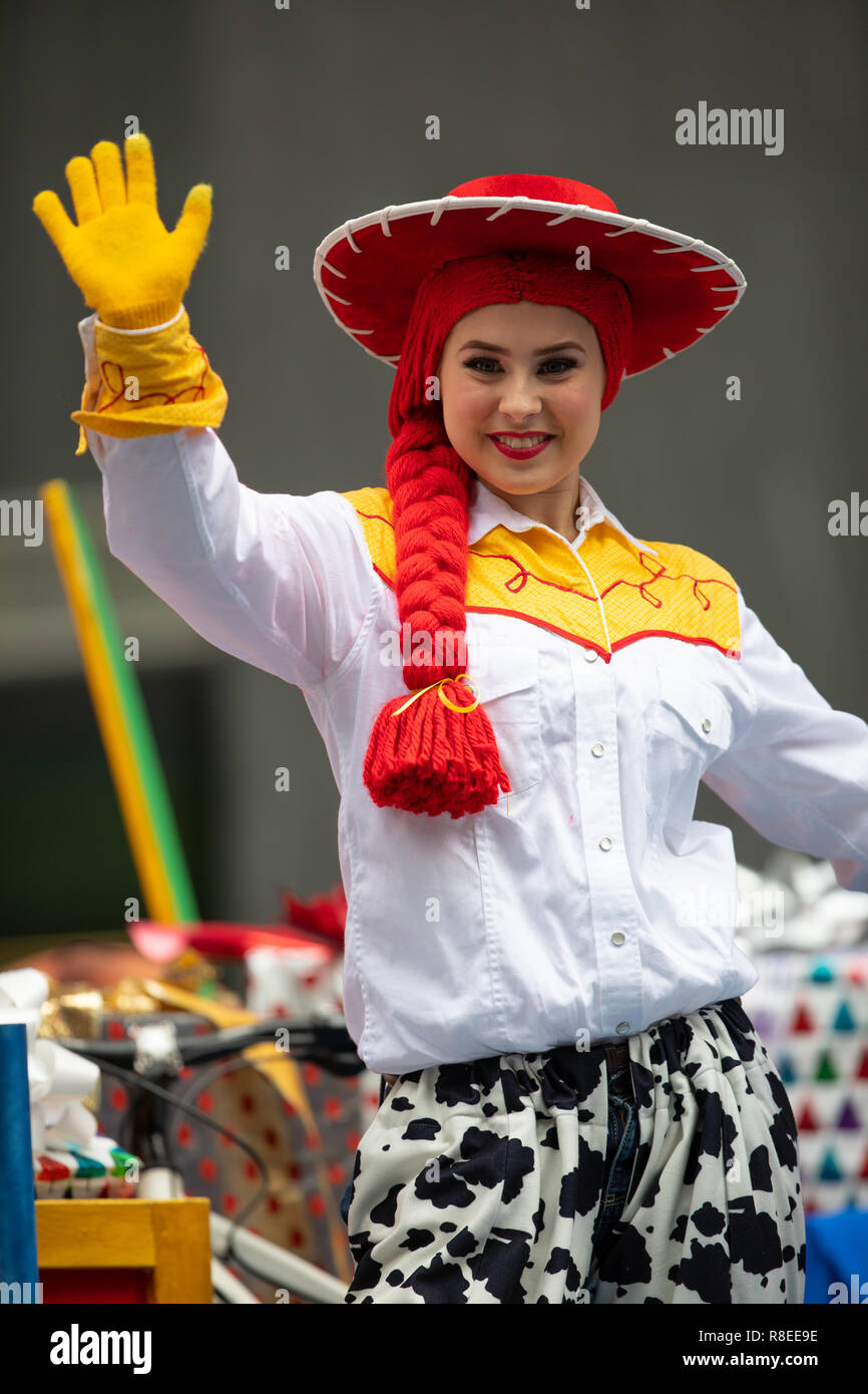 Houston, Texas, USA - November 22, 2018 The H-E-B Thanksgiving Day Parade,  Woman on a float waving at people dress up as Jessie Toy Story Character  Stock Photo - Alamy