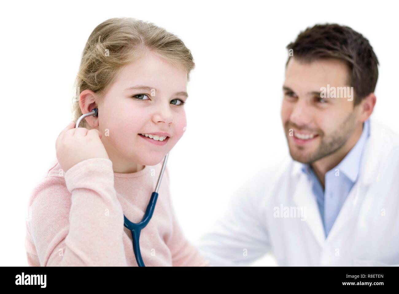 Girl role playing doctor with stethoscope. Stock Photo