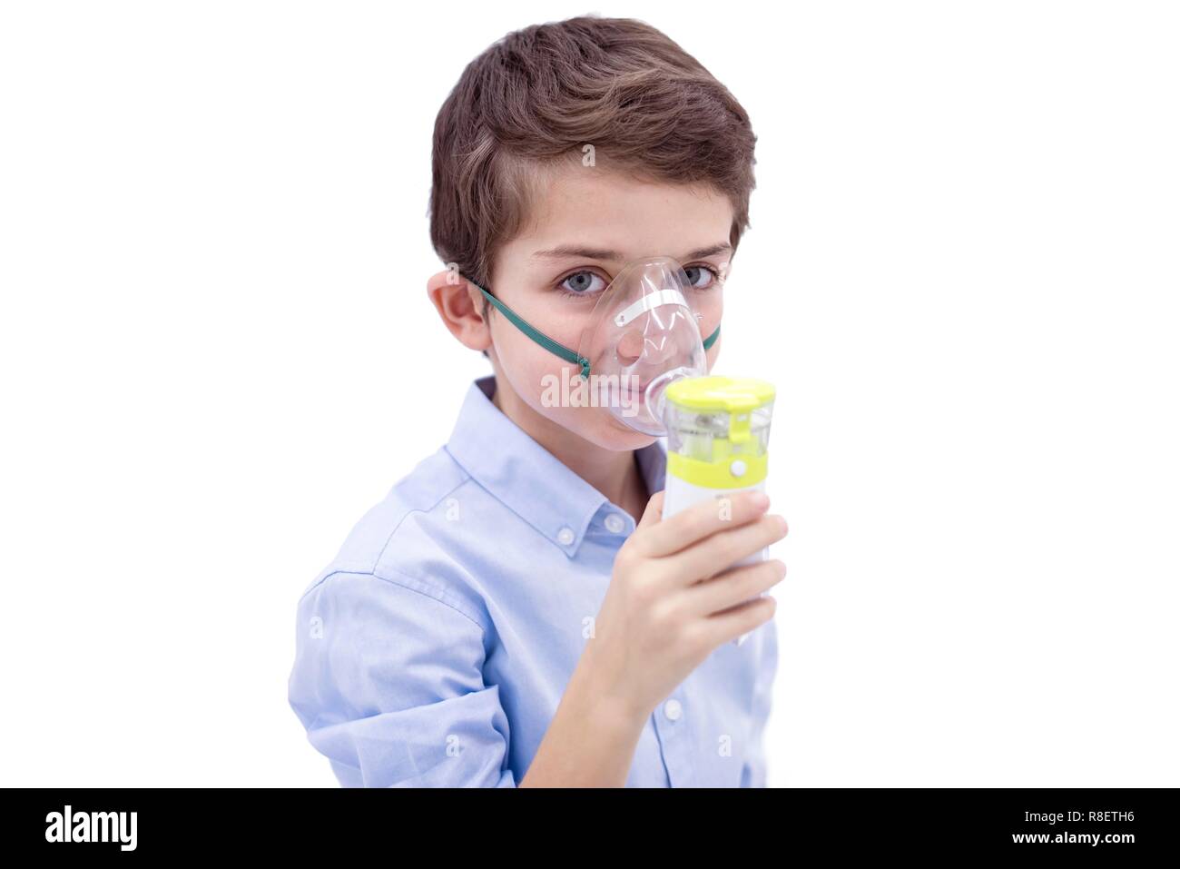 Boy using nebuliser Stock Photo