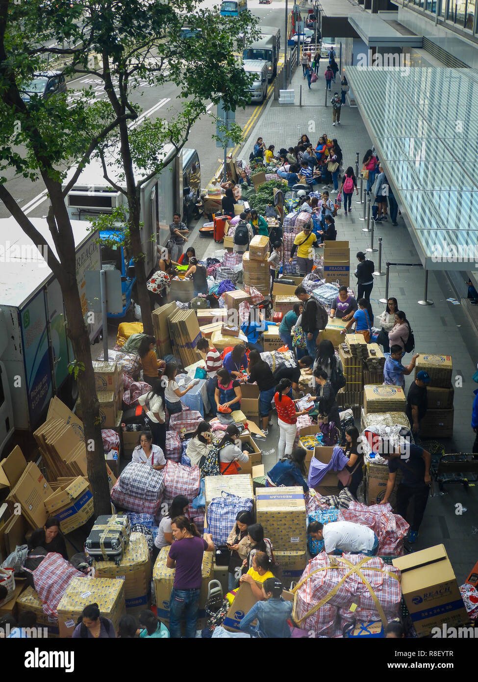 Central, Hong Kong Street scene, migrant workers pack goods for shipment to send back to home