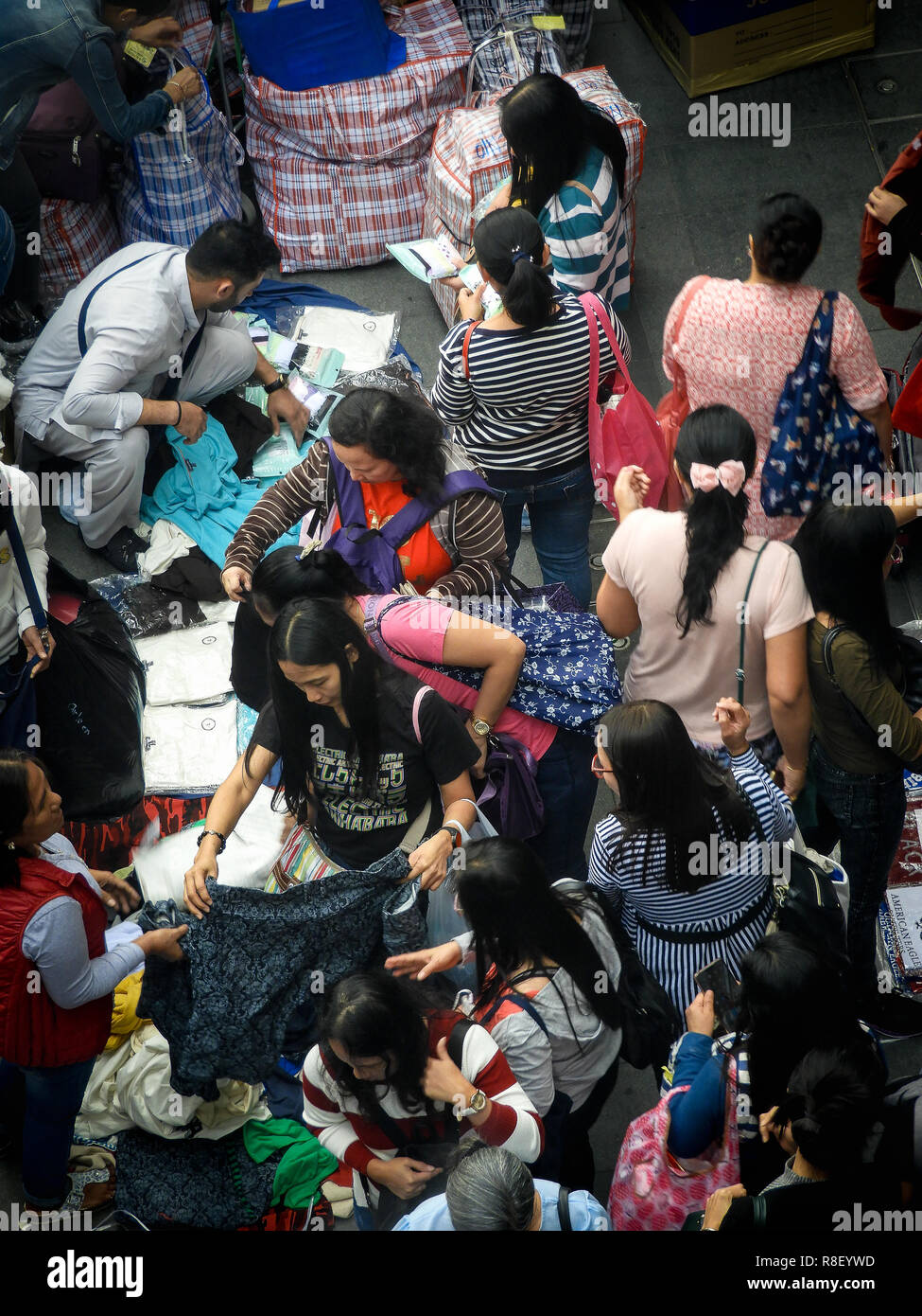 Central, Hong Kong Street scene, migrant workers pack goods for shipment to send back to home