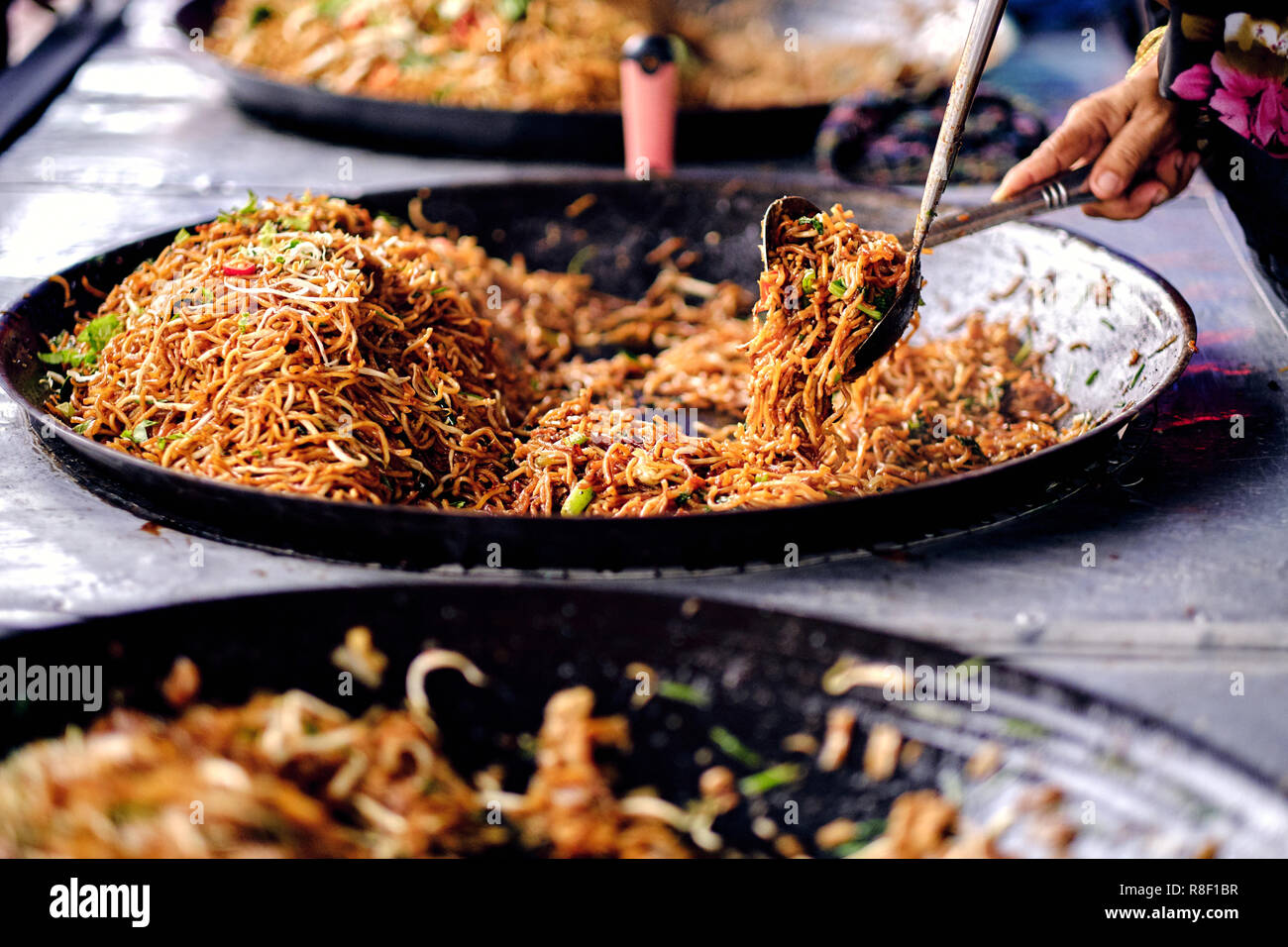 Asian, Indian and Chinese street food. Food court on local market of