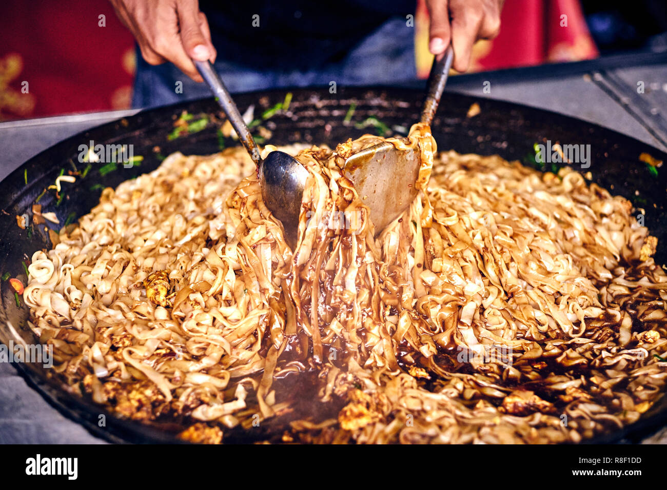 Fried noodles in a wok. Asian, Indian and Chinese street food. Food