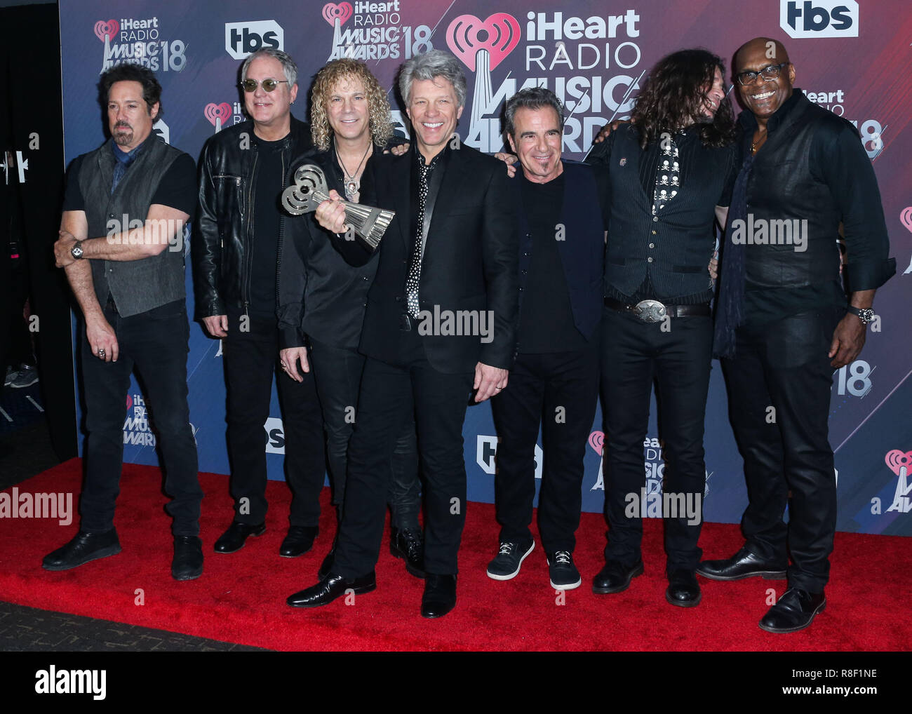 INGLEWOOD, LOS ANGELES, CA, USA - MARCH 11: Hugh McDonald, David Bryan, Jon Bon Jovi, Tico Torres, Phil X, Everett Bradley, Bon Jovi in the press room at the 2018 iHeartRadio Music Awards held at The Forum on March 11, 2018 in Inglewood, Los Angeles, California, United States. (Photo by David Acosta/Image Press Agency) Stock Photo