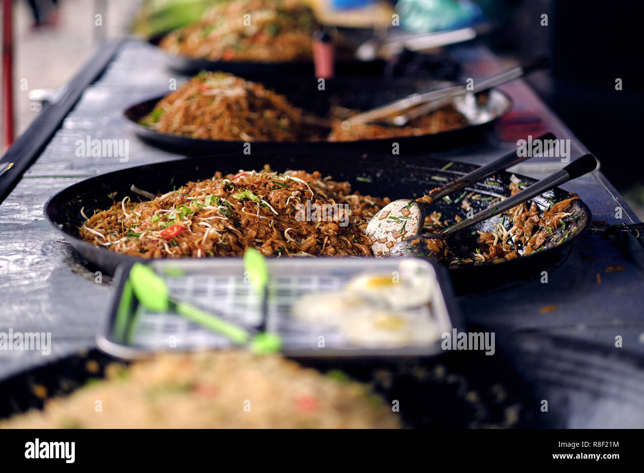 Asian, Indian and Chinese street food. Food court on local market of
