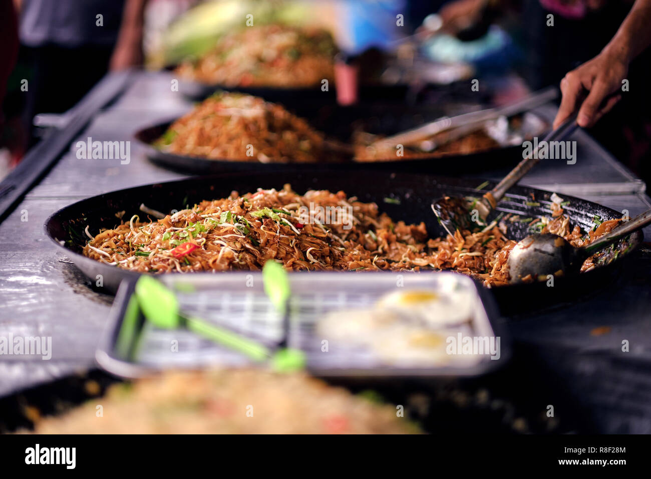 Asian, Indian and Chinese street food. Food court on local market of